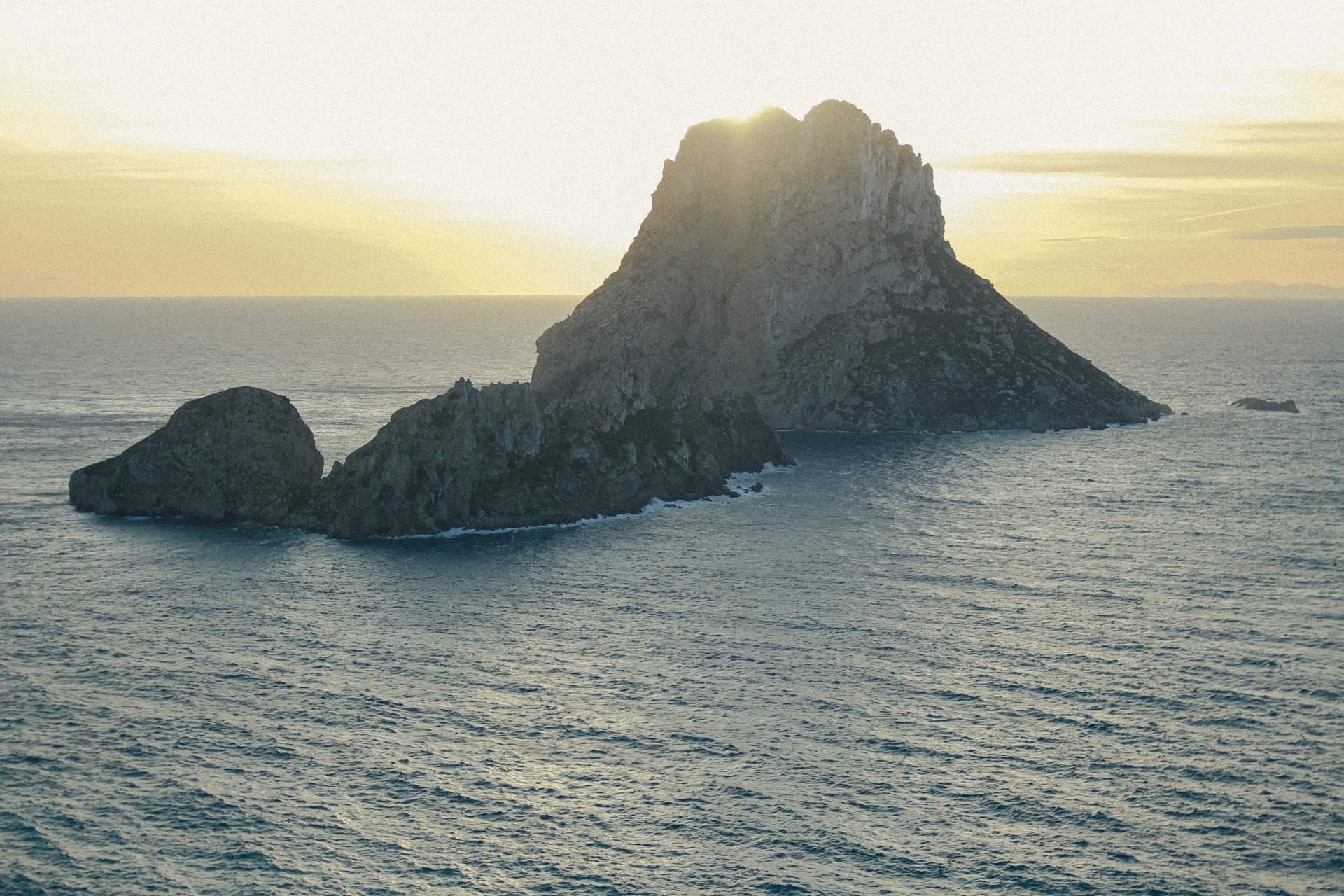 Es Vedra rising from the sea off Ibiza's west coast Es Vedra rising from the sea off Ibiza's west coast